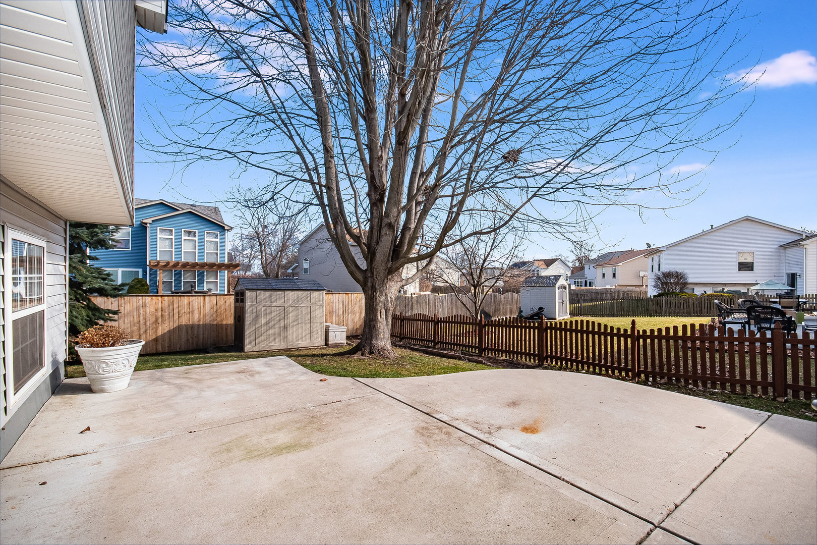 7211 Faxton Lane Plainfield, IL 60586 - Photo 17 of 21 a view of a backyard with large trees