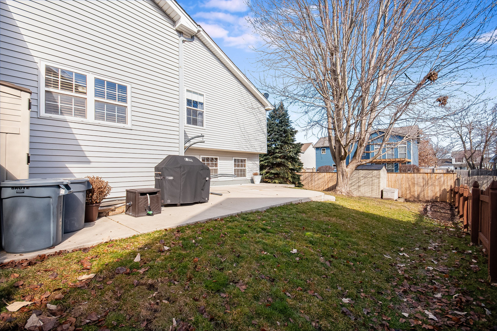 7211 Faxton Lane Plainfield, IL 60586 - Photo 20 of 21 a view of backyard of house with outdoor seating