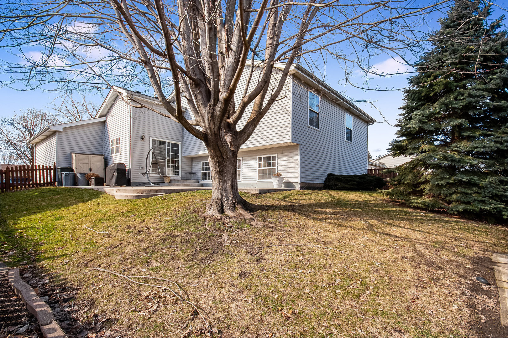 7211 Faxton Lane Plainfield, IL 60586 - Photo 21 of 21 a house view with swimming pool in front of it