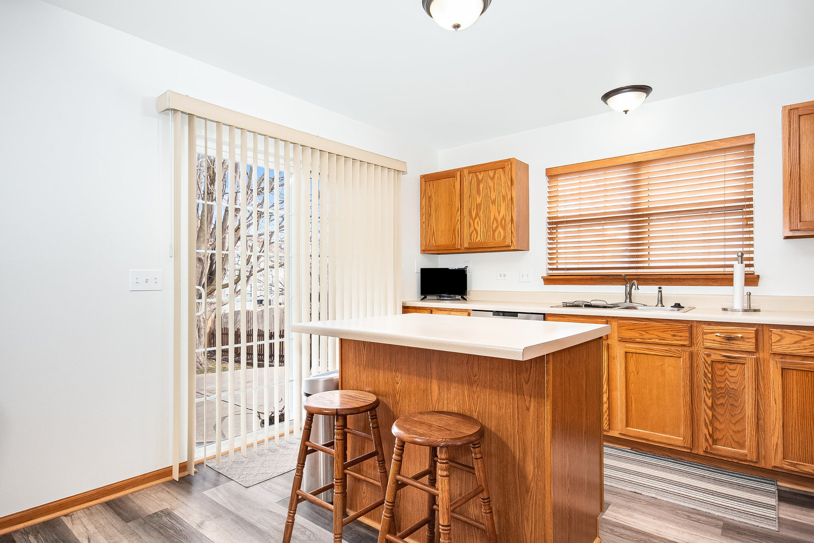 7211 Faxton Lane Plainfield, IL 60586 - Photo 4 of 21 a kitchen with stainless steel appliances a sink and a stove