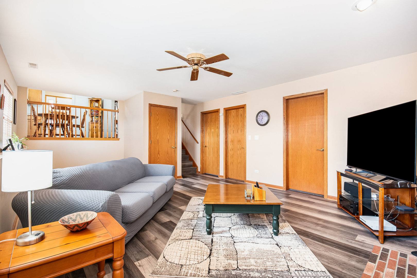 7211 Faxton Lane Plainfield, IL 60586 - Photo 7 of 21 a living room with furniture and a flat screen tv
