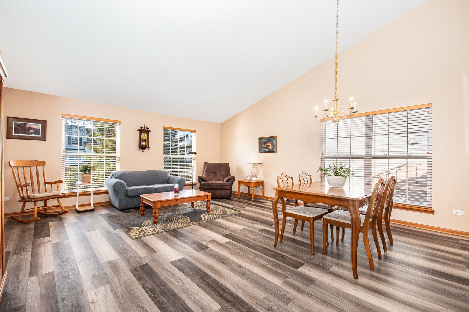7211 Faxton Lane Plainfield, IL 60586 - Photo 8 of 21 a living room with furniture a rug and a large window