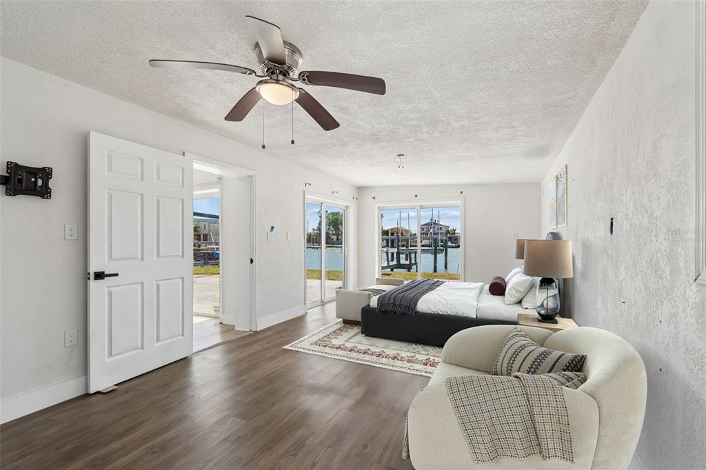 16108 5th Street East Redington Beach, FL 33708 - Photo 17 of 46 a bedroom with a bed and wooden floor