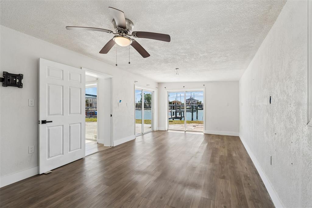 16108 5th Street East Redington Beach, FL 33708 - Photo 18 of 46 a view of an empty room with wooden floor