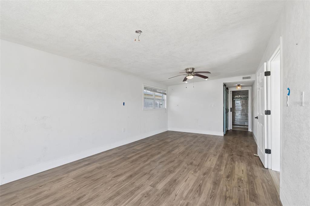 16108 5th Street East Redington Beach, FL 33708 - Photo 20 of 46 wooden floor in an empty room