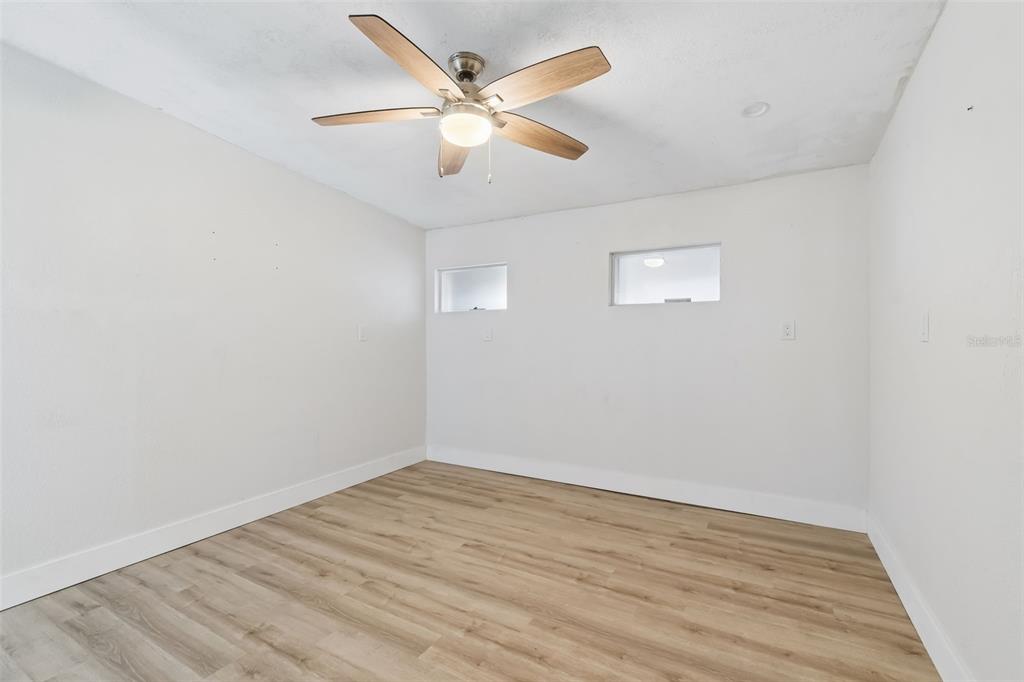 16108 5th Street East Redington Beach, FL 33708 - Photo 25 of 46 wooden floor in an empty room