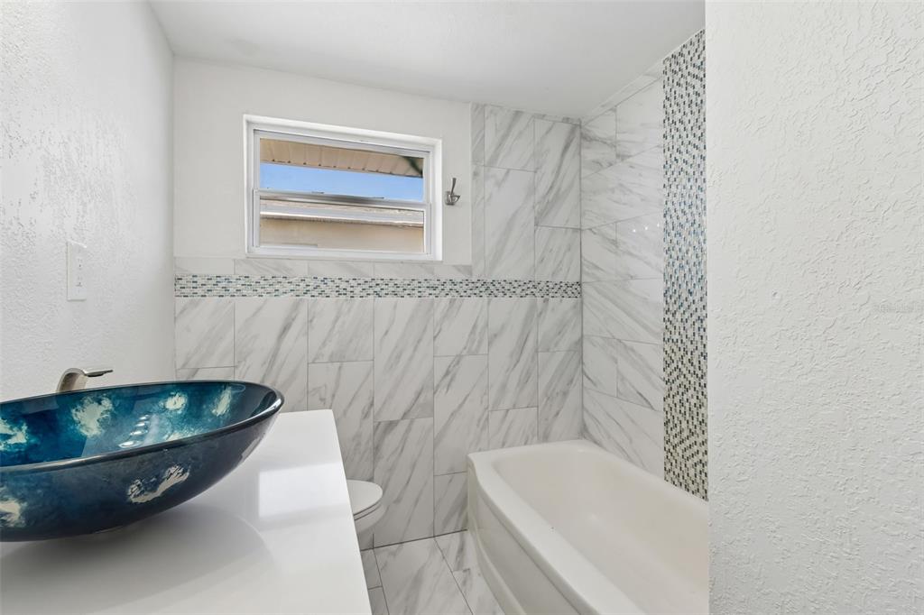 16108 5th Street East Redington Beach, FL 33708 - Photo 26 of 46 a bathroom with a sink and bathtub