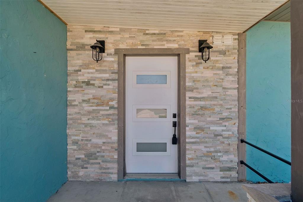 16108 5th Street East Redington Beach, FL 33708 - Photo 4 of 46 a front view of a house with a shower