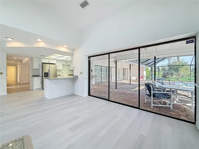 a spacious bathroom with a tub sink and mirror