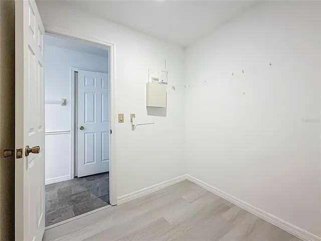 a bathroom with a granite countertop toilet a sink and a mirror