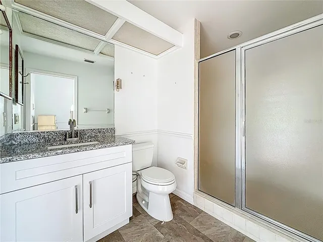 a view of a porch with dining table and chairs