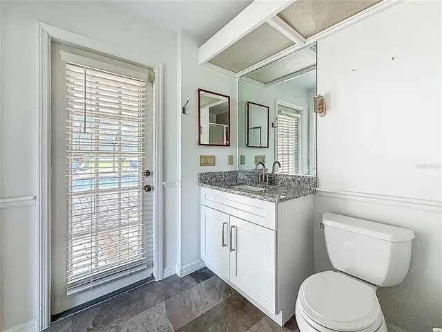 a view of a chairs and table in the patio