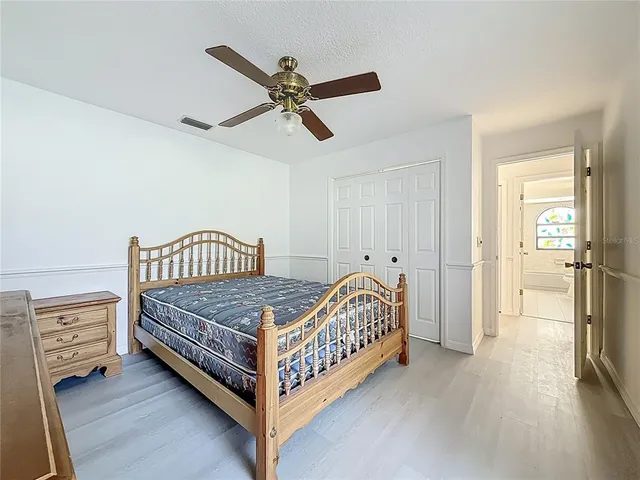 a big house with a big yard and large trees