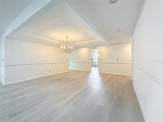 a kitchen with granite countertop a sink and cabinets
