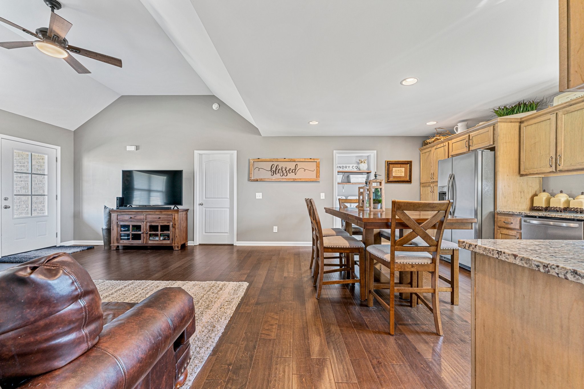 146 A T G T Road Portland, TN 37148 - Photo 8 of 34 a living room with furniture and a dining table with kitchen view