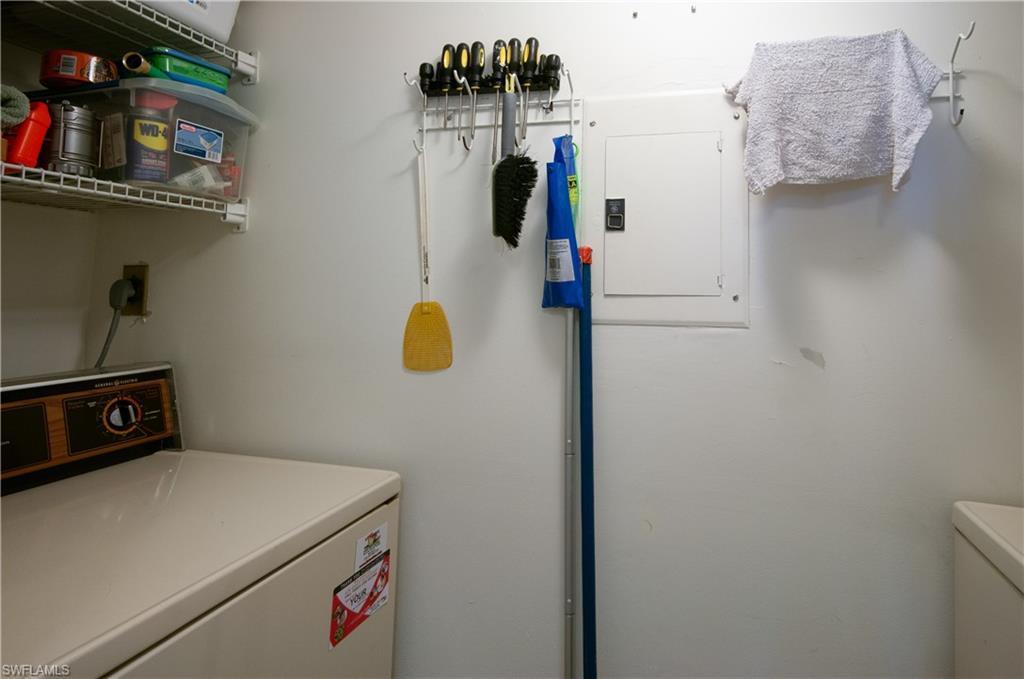 29 High Point Circle East, Unit 508 Naples, FL 34103 - Photo 17 of 35 a utility room with dryer and washer