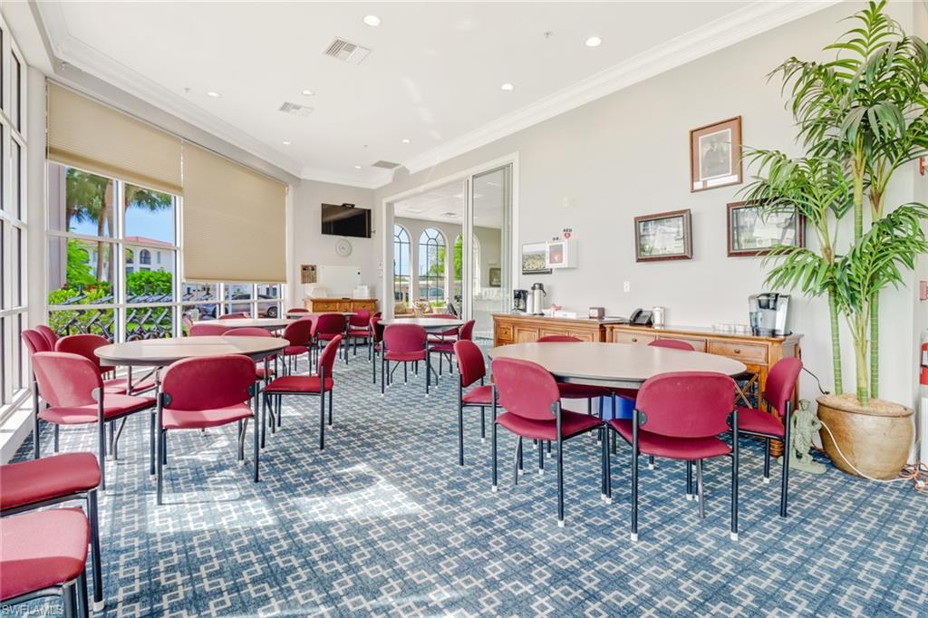 29 High Point Circle East, Unit 508 Naples, FL 34103 - Photo 29 of 35 a view of a dining room with furniture window and outside view