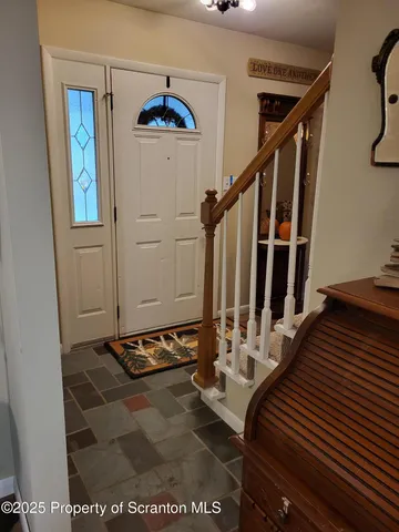 a bedroom with a bed and a flat tv screen