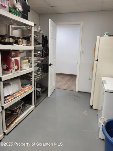 a backyard of a house with wooden fence and trees