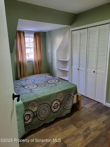 a view of a house with swimming pool and sitting area