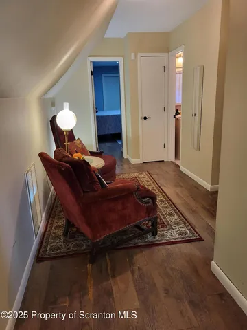 a view of road with large trees