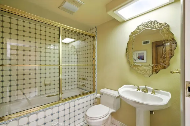 a bedroom with furniture and a flat screen tv