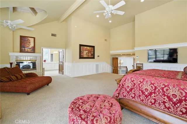 a large bathroom with a sink mirror and a bathtub next to a window
