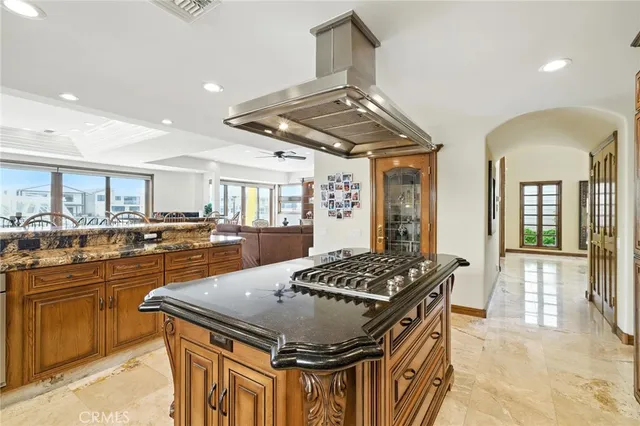 a living room with furniture kitchen view and a dining table