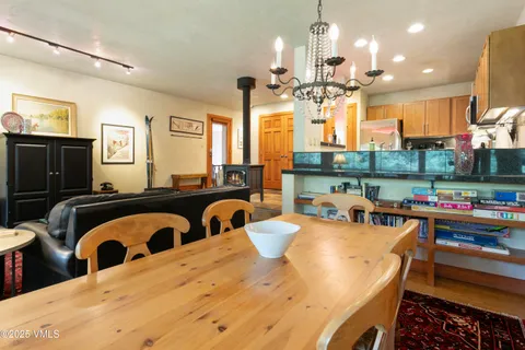 a view of a dining room kitchen and a large window