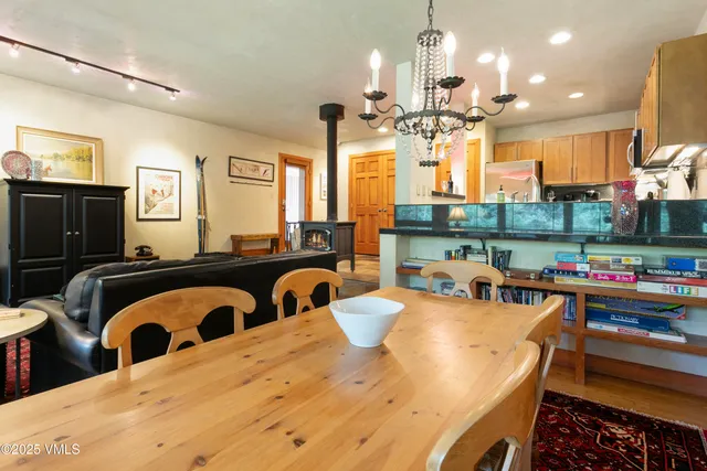 a view of a dining room kitchen and a large window