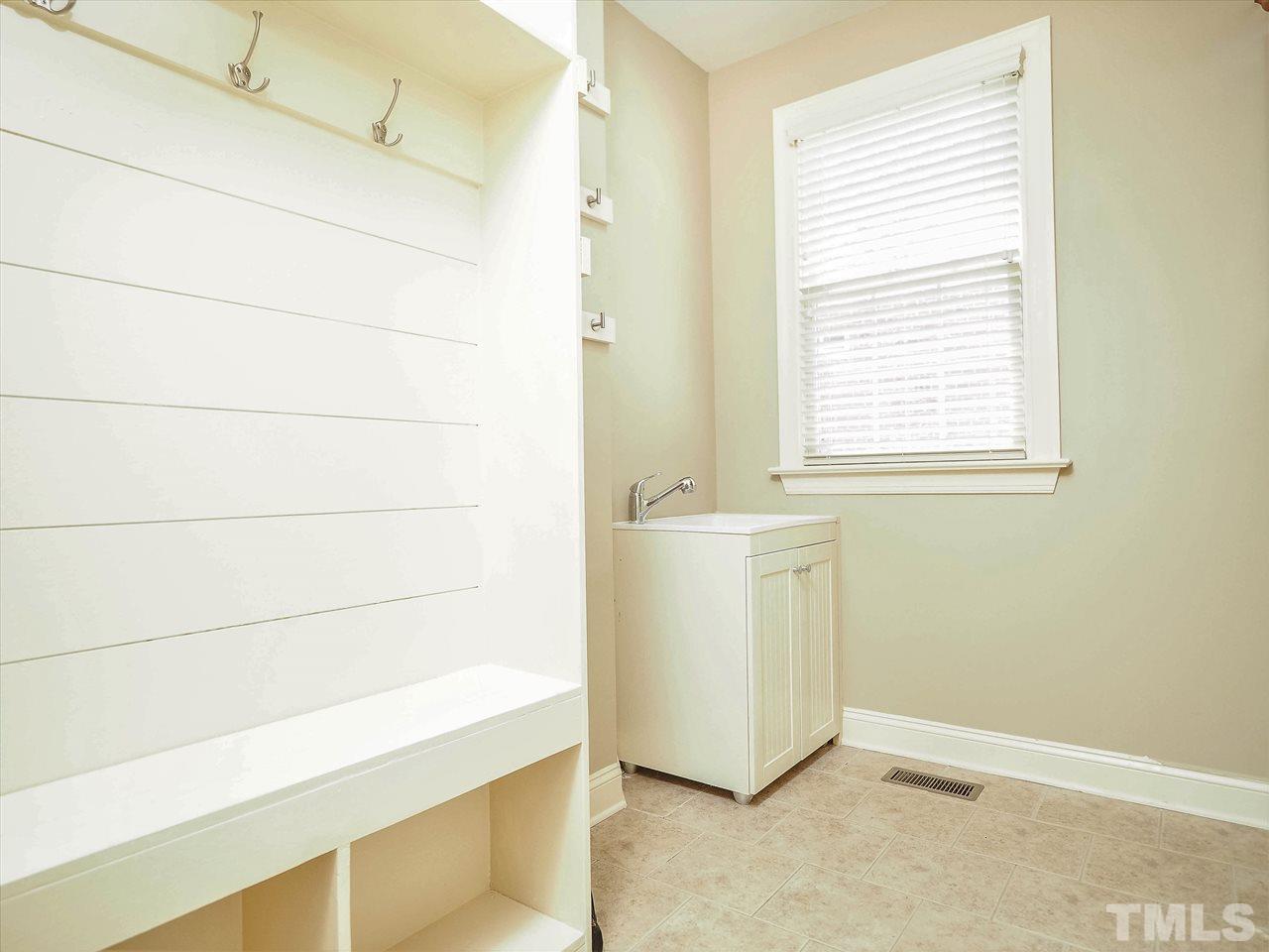 11830 Lowery Ridge Drive Raleigh, NC 27614 - Photo 14 of 30 First floor laundry with sink - built-in Drop Zone for coming and going!