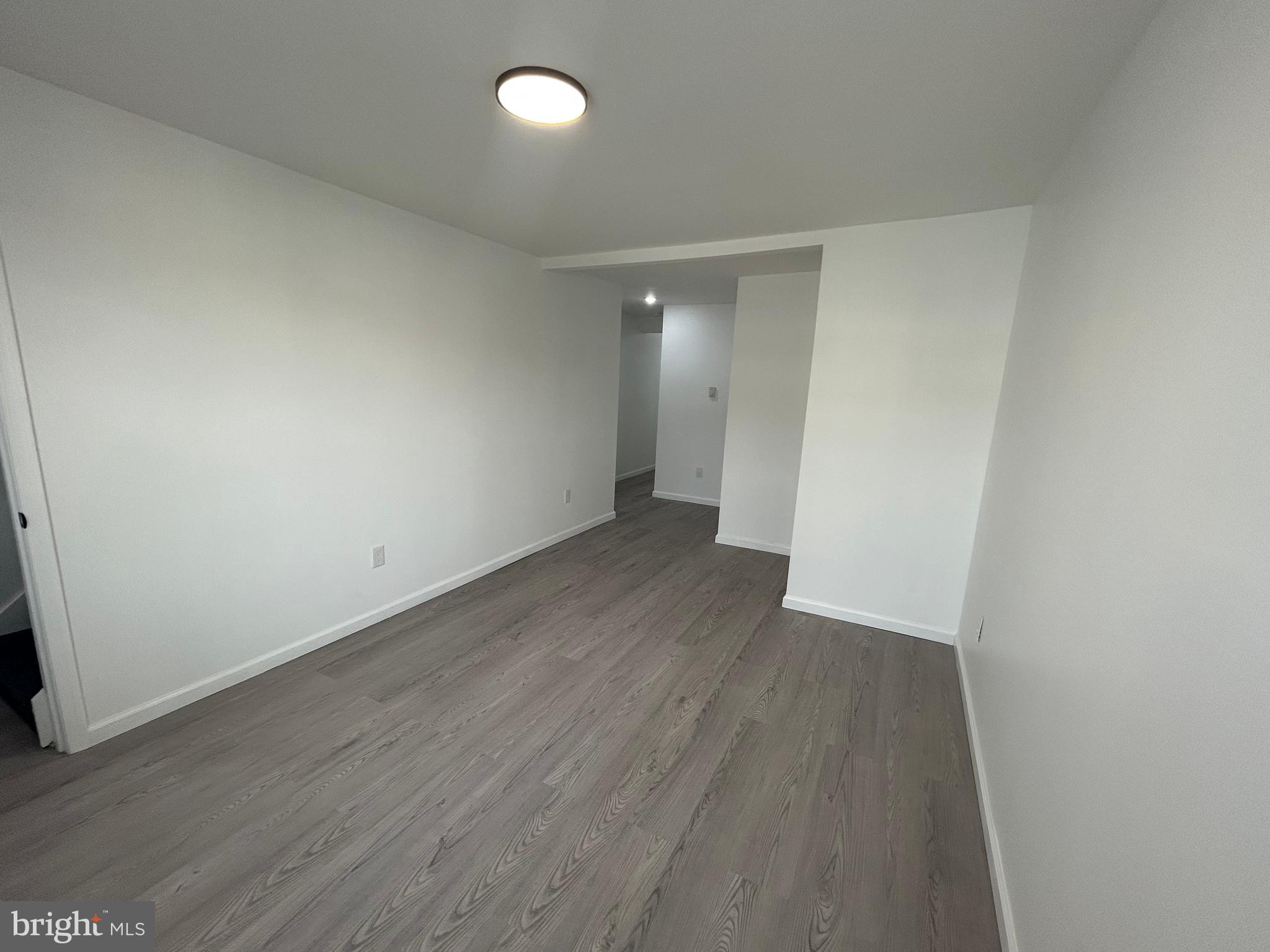 222 West Patterson Street, Unit 4 Lansford, PA 18232 - Photo 3 of 18 an empty room with wooden floor and entrance