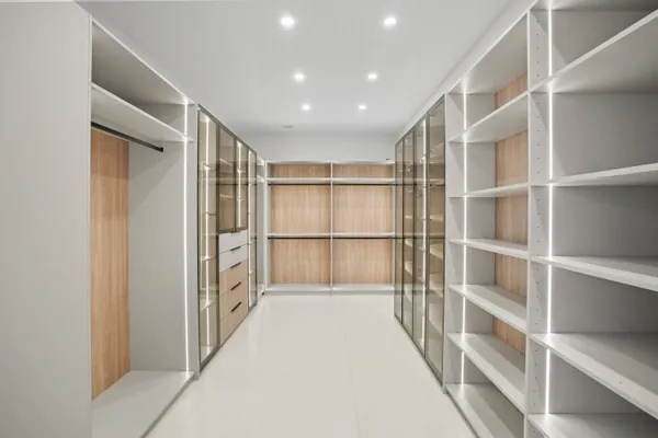 a spacious bathroom with a mirror and a shower