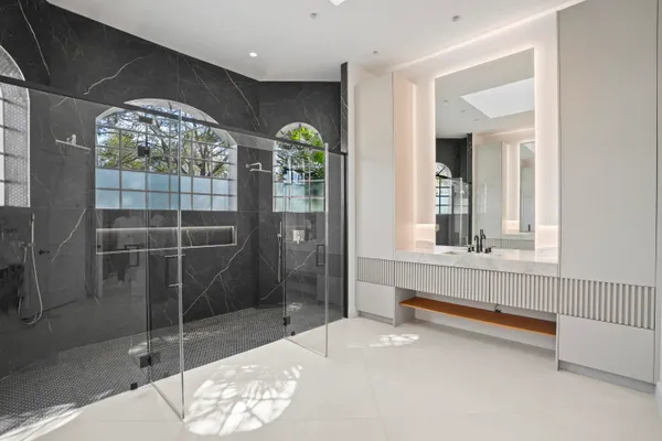 a bathroom with a sink a toilet and tub
