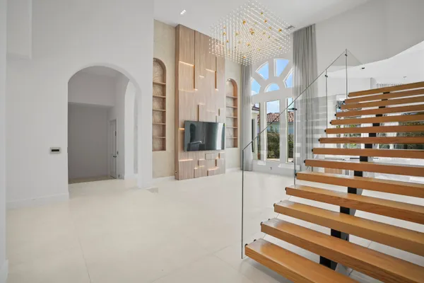 a bathroom with a shower and a glass door