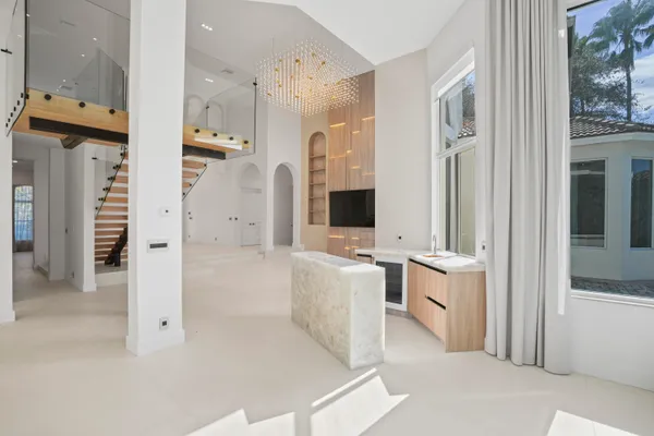 a bathroom with a granite countertop sink a toilet and shower