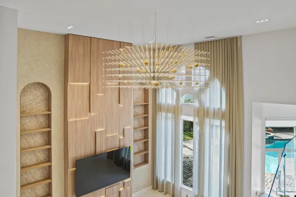 a view of a livingroom with furniture and a window