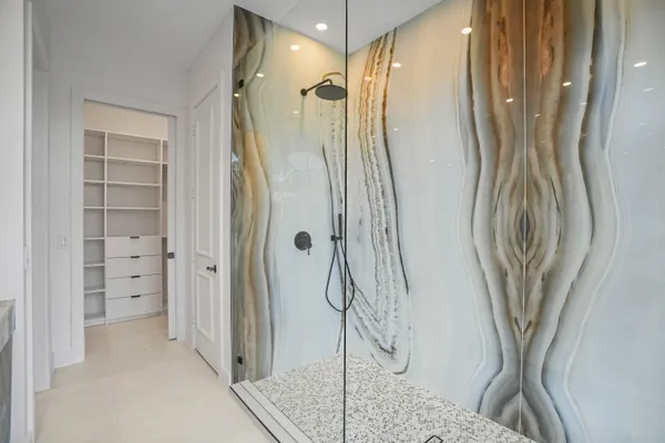 a living room with furniture a fireplace and lots of windows