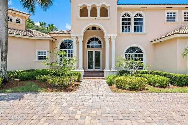 a dining room with furniture and chandelier