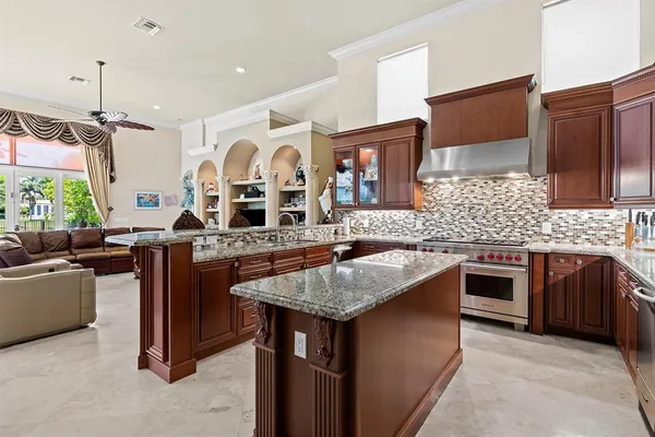 a utility room with cabinets washer and dryer