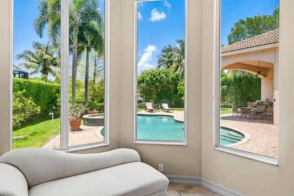 a livingroom with workspace and a couch
