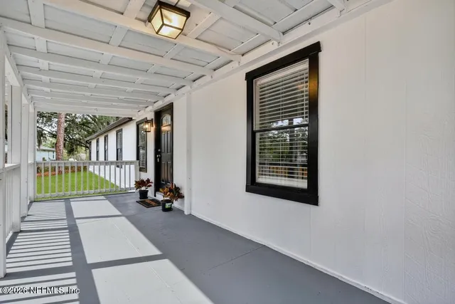 a dining room with furniture and chandelier