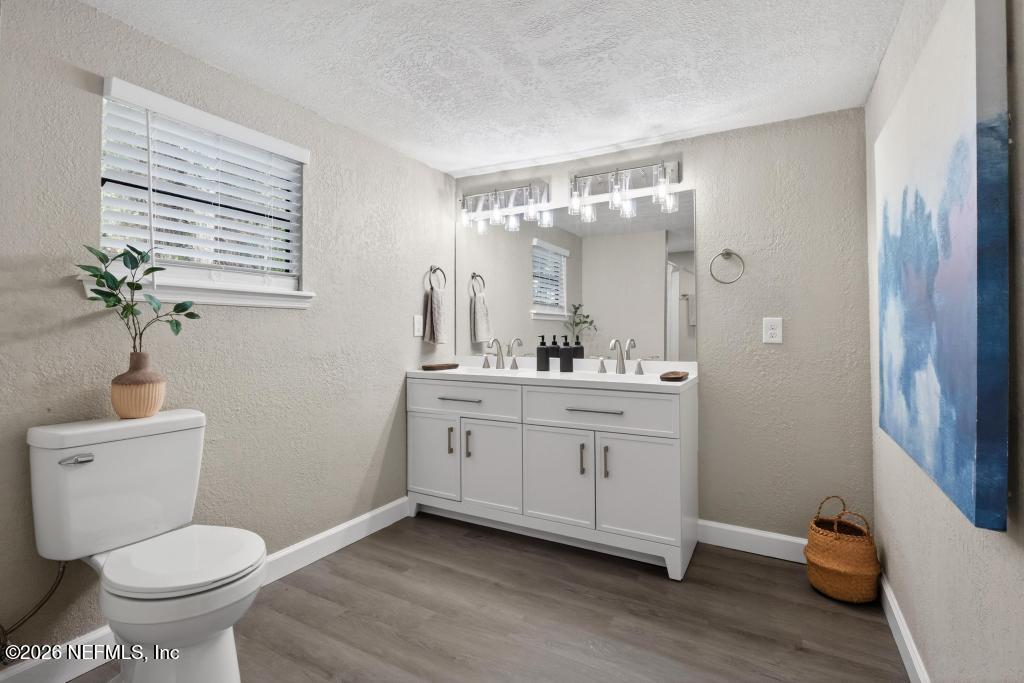 95422 Plum Loop Fernandina Beach, FL 32034 - Photo 60 of 84 a bathroom with a toilet sink and mirror