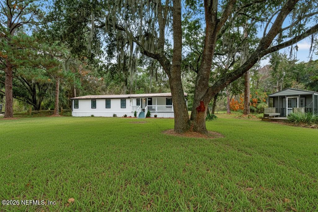 95422 Plum Loop Fernandina Beach, FL 32034 - Photo 6 of 84 a view of house that has a big yard