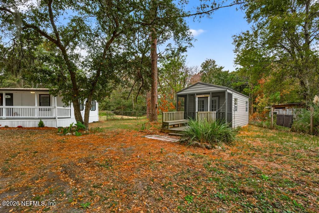 95422 Plum Loop Fernandina Beach, FL 32034 - Photo 82 of 84 a view of a house with backyard and trees