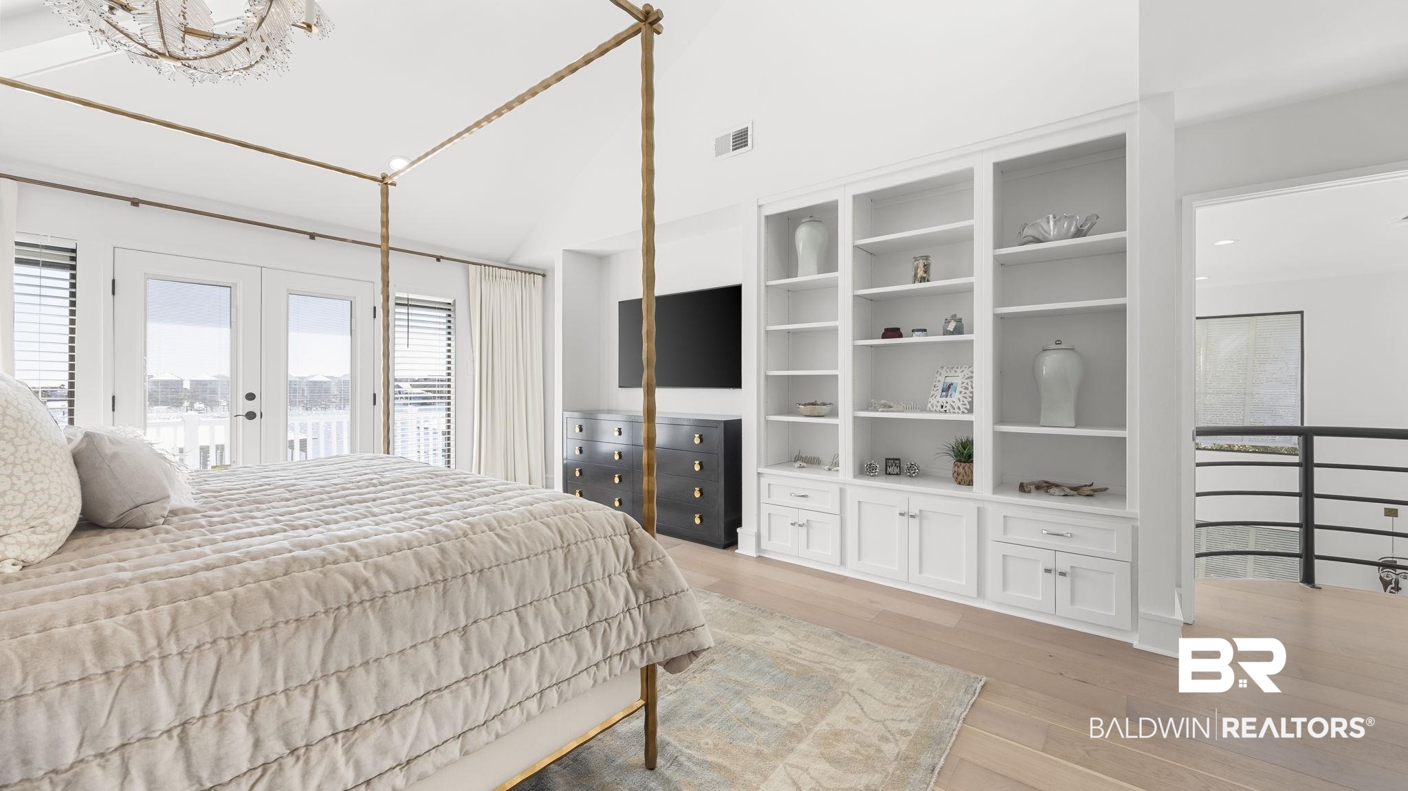30194 River Road Orange Beach, AL 36561 - Photo 11 of 45 Bedroom featuring access to exterior, vaulted ceiling, light wood-type flooring, french doors, and suspended lighting