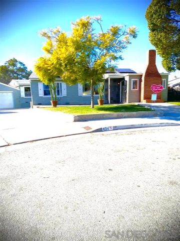 a view of front of house with a swimming pool