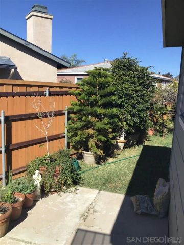 a view of a backyard of the house