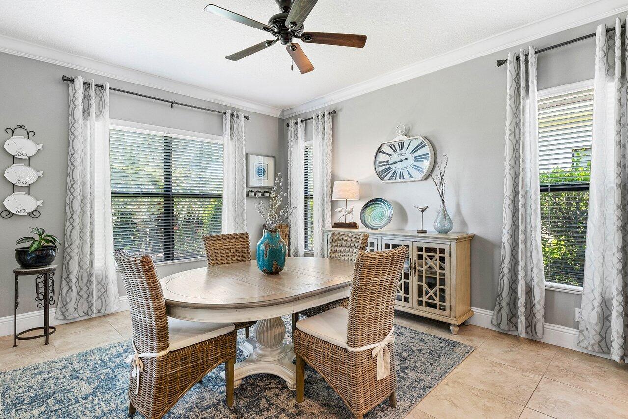 183 Calmo Circle Port St. Lucie, FL 34984 - Photo 14 of 38 a view of a dining room with furniture and a window