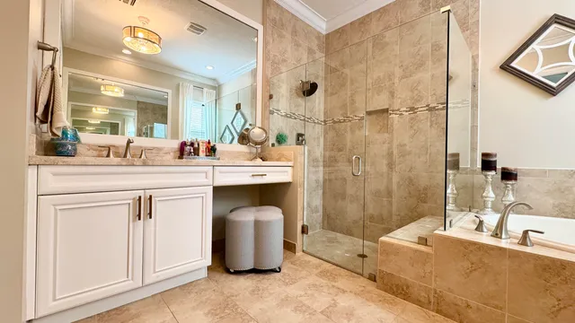 a spacious bathroom with a granite countertop sink mirror and shower